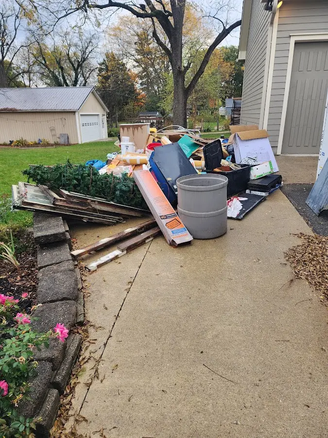 Dumpster being loaded with debris for Commercial Dumpster Rental in Pine Castle